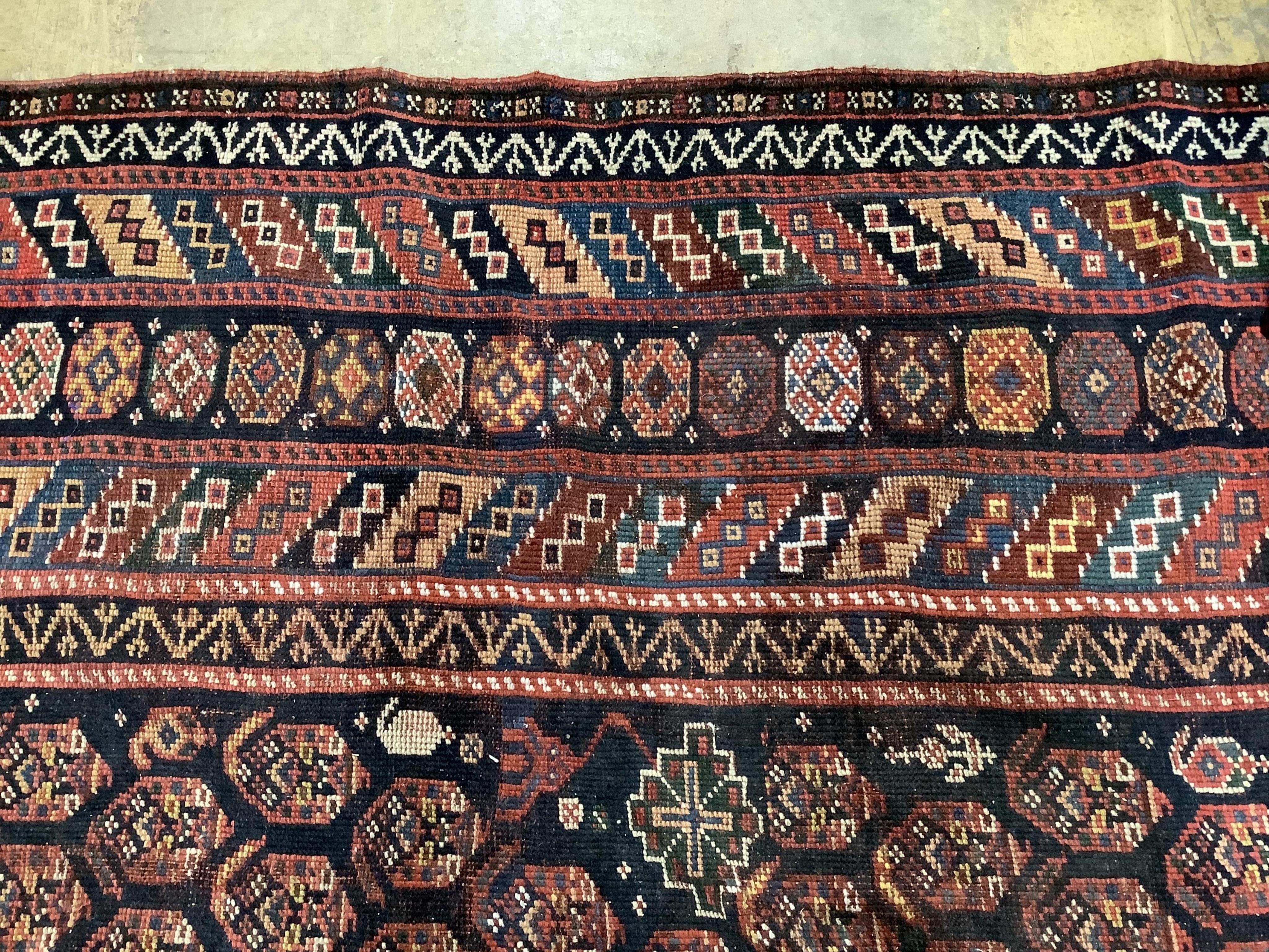 An antique Shirvan blue ground Boteh carpet, 290 x 170cm. Condition - fair